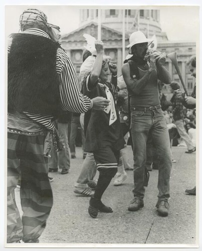 Costumed celebrants in front of City Hall