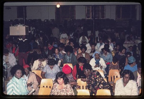 Peoples Temple members preparing issues of Peoples Forum in church service