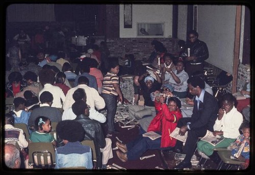 Peoples Temple members preparing issues of Peoples Forum in church service