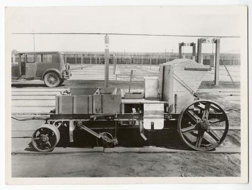 Machine for planting guayule seed in the nursery beds