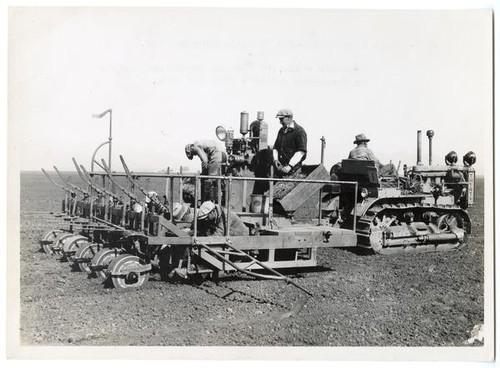 Side view of six-row transplanting machine for guayule crops