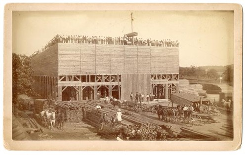 Men and women at a flour mill