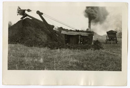 Using machinery to dig trenches, circa 1924