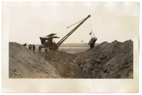 Digging a pit for the animals' corpses, circa 1924