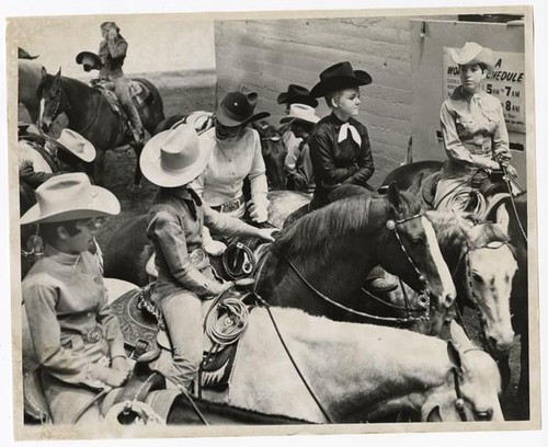 Horsewomen astride saddle horses