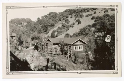 View of a ranch house built on a hillside