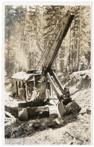 Bucyrus steam shovel moving earth, California