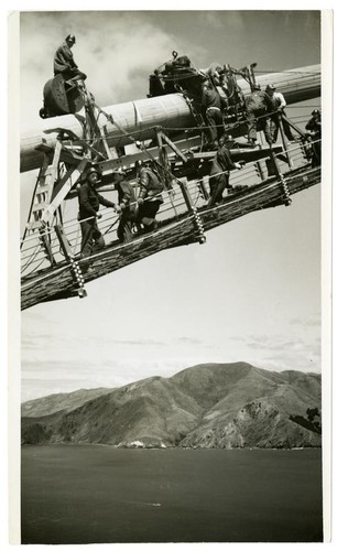 Golden Gate Bridge construction workers on cable catwalk