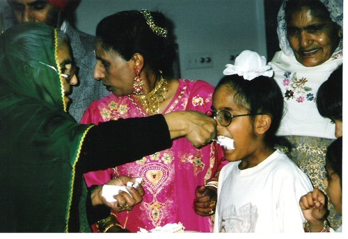 Amar Kaur Feeds Boy Cake