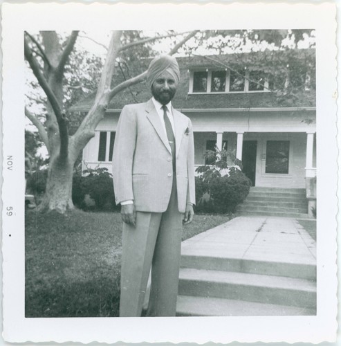 Hari Singh Everest Standing in Front of House