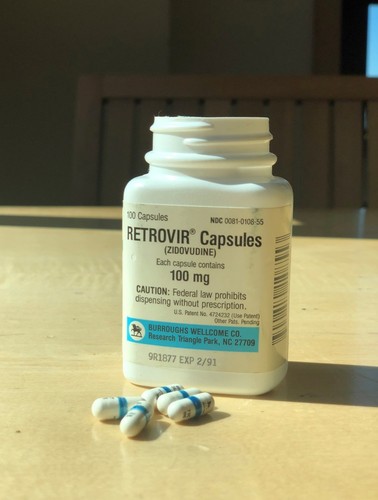 Picture of packaging and capsules of Retrovir brand Zidovudine manufactured by Burroughs Wellcome Co. 