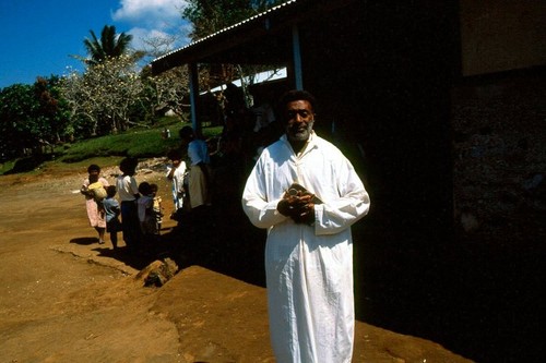 Catechist Lawrence in front of the Church