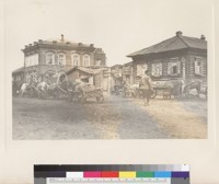 Photo 21:Shop sign says "Gostinyi dvor L.G.(?) Kozlova). Sign on left also indicates a proprieter named Kozlov