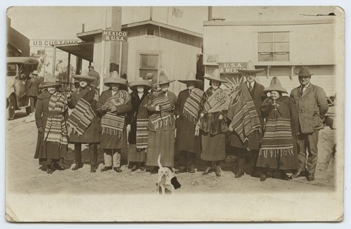 Tourists in Mexican costume near U.S.-Mexico border station