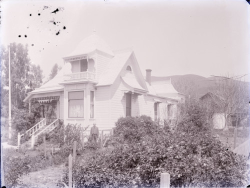 Man Standing in Front Yard