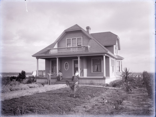 House with People in Front Yard