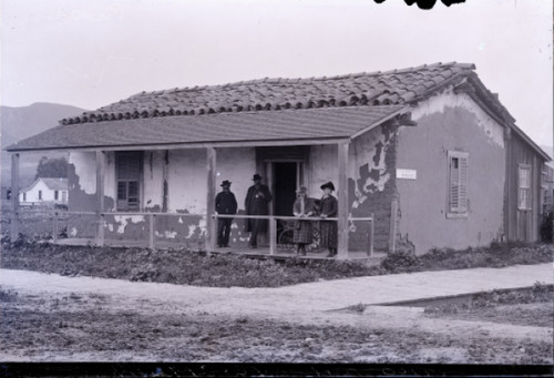 Men and Women on the Front Porch of Tico Adobe