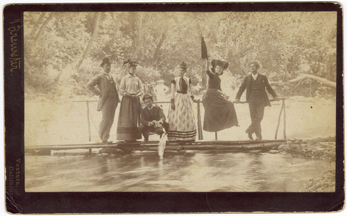 Group Photo on Bridge Over Water