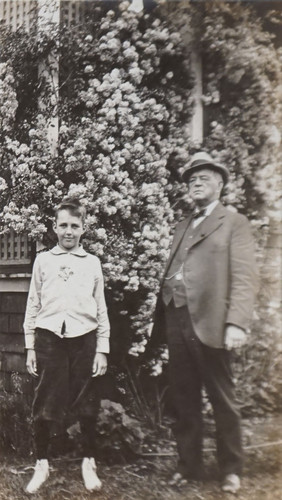 E.W. Daily and Boy in Rose Garden