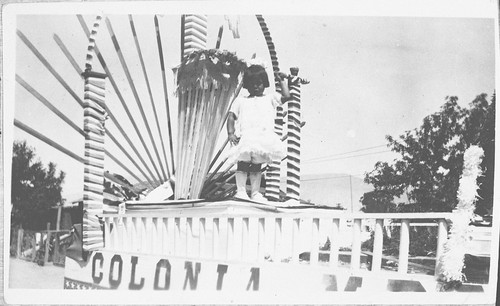 Irene Sanchez as a Little Girl, Standing on Parade Float