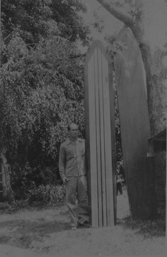 John Larronde Poses with Surfboards