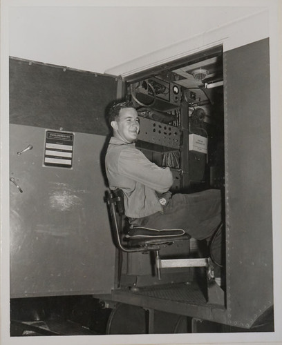 Young Man Seated at Schlumberger Logging Unit