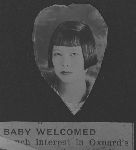 Heart-shaped Portrait of Daisy Jue with Newspaper Clipping