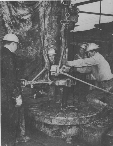 Men Working With Drill