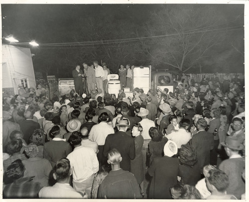 Crowd Waiting at an Appliance Drawing at Veever's Service Station