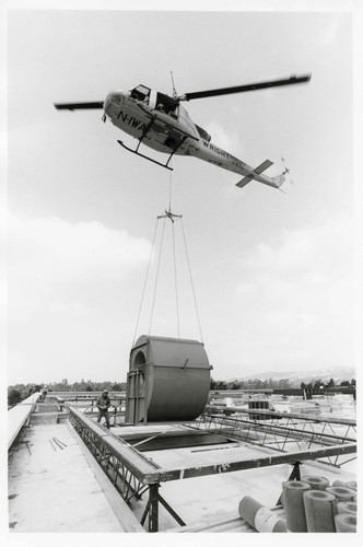 Helicopter Placing Equipment on Roof