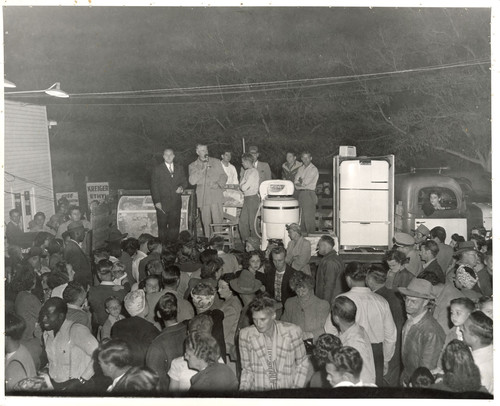 Crowd Waiting at an Appliance Drawing at Veever's Service Station