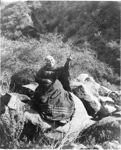 Candelaria Valenzuela Sitting on a Boulder