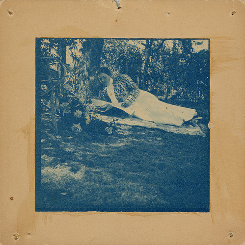 Woman Lounging in Garden