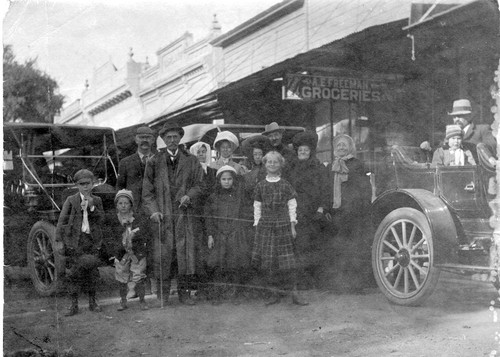 Families in Front of a Grocery Store