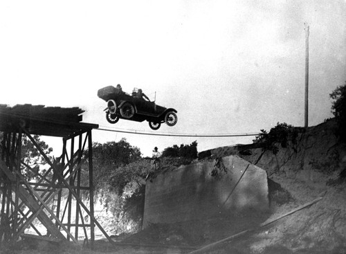 Actors Performing a Stunt in a Car