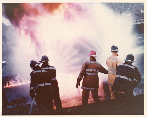 Firefighters Putting Out Oil Fire