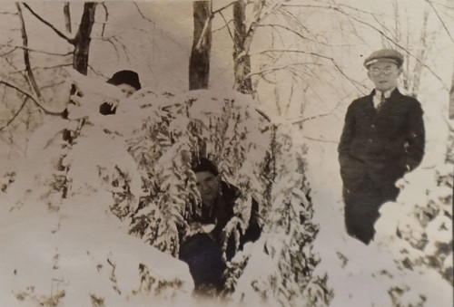 Daily Family Among Trees in Snow