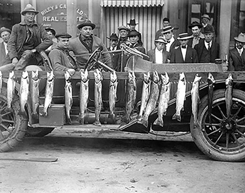 Men Pose with Steelhead Trout