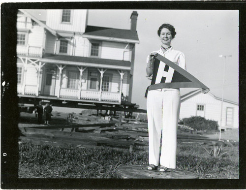 Young Woman in Front of Point Hueneme Lighthouse on Platform for Relocation