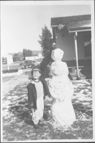 Boy With Snowman
