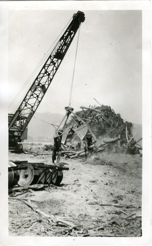 Using Clamshell to Pile Debris after St. Francis Dam Disaster