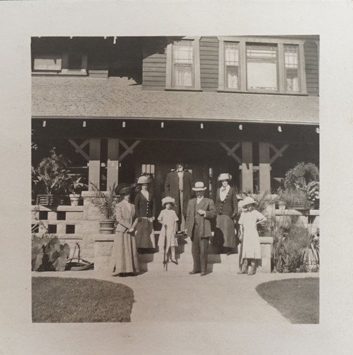 E.W. Daily Family in Front of Their Home