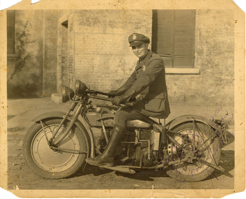 Police Officer Seated on Motorcycle