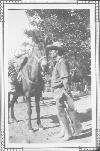Charlie Ruiz Leading a Mule