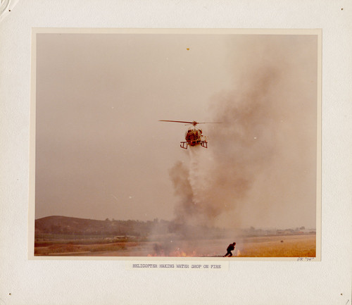 Helicopter Dropping Water on Fire