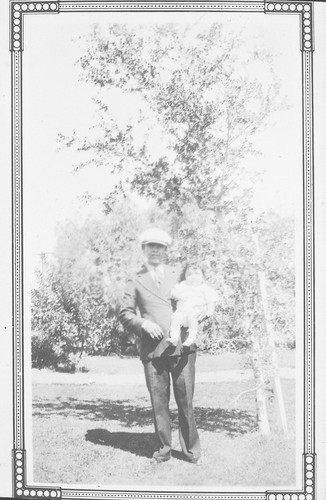 Juan Gonzalez De La Rosa Holding Son John as a Baby