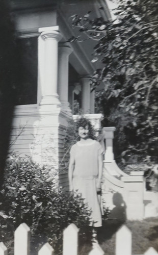 Woman on Side of Front Porch