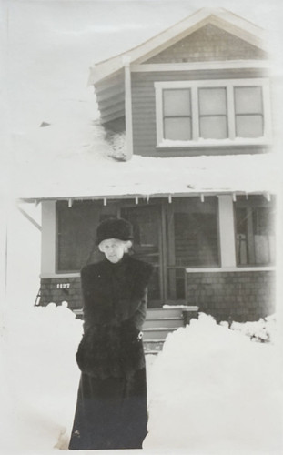 Woman Outside Home in Snow