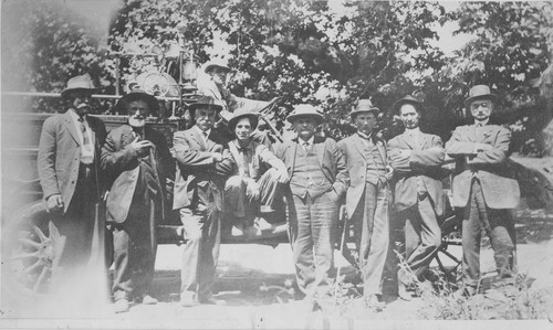 Group Photo of Men in Front of Tractor