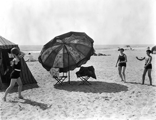Women Playing Catch on Beach